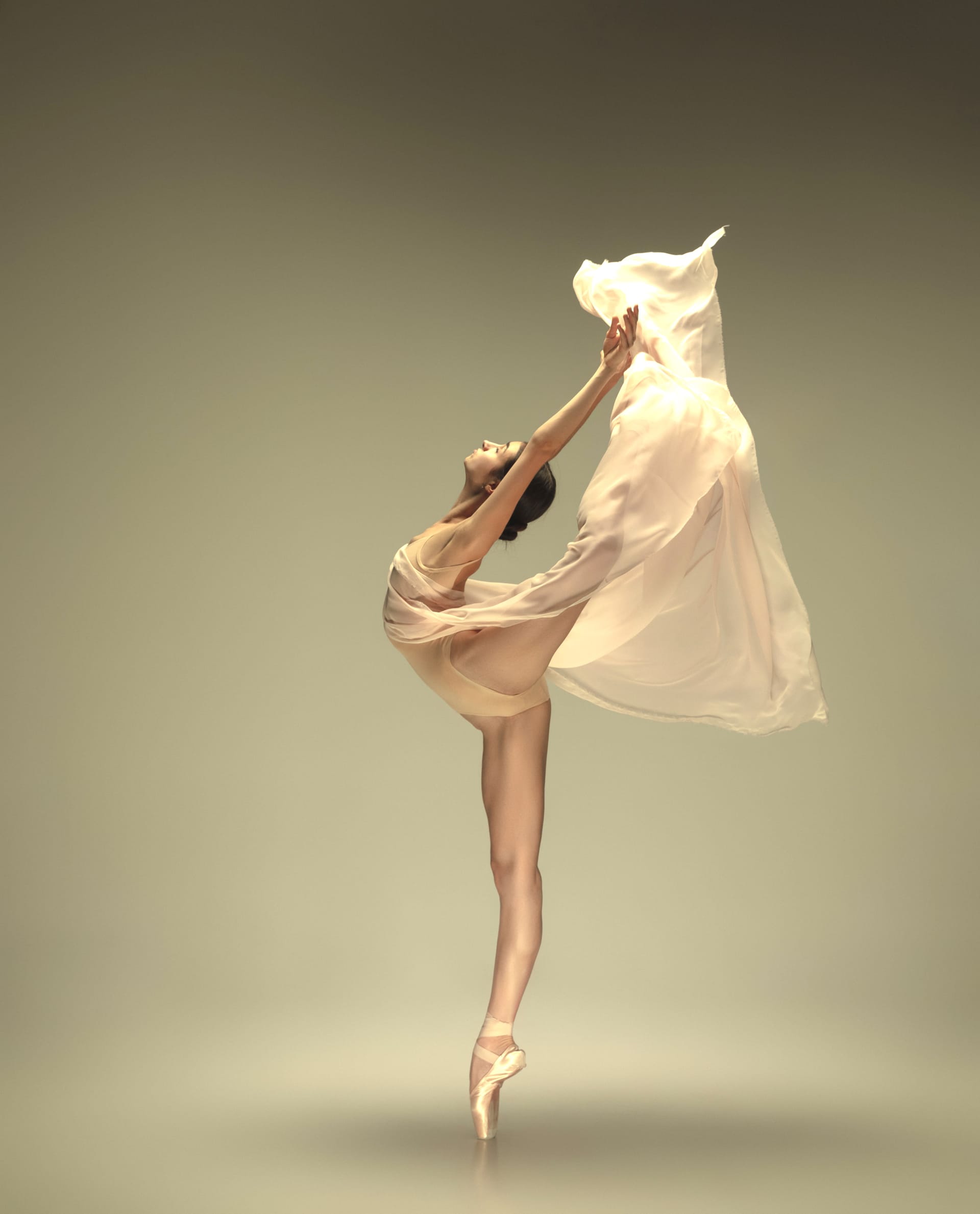 Young graceful tender ballerina pastel wall