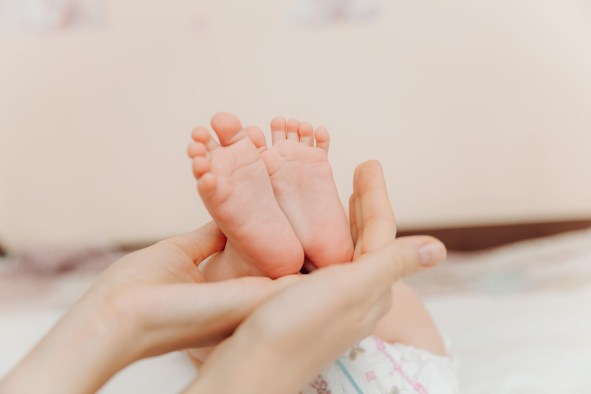Hands mom her child happy family concept baby feet image