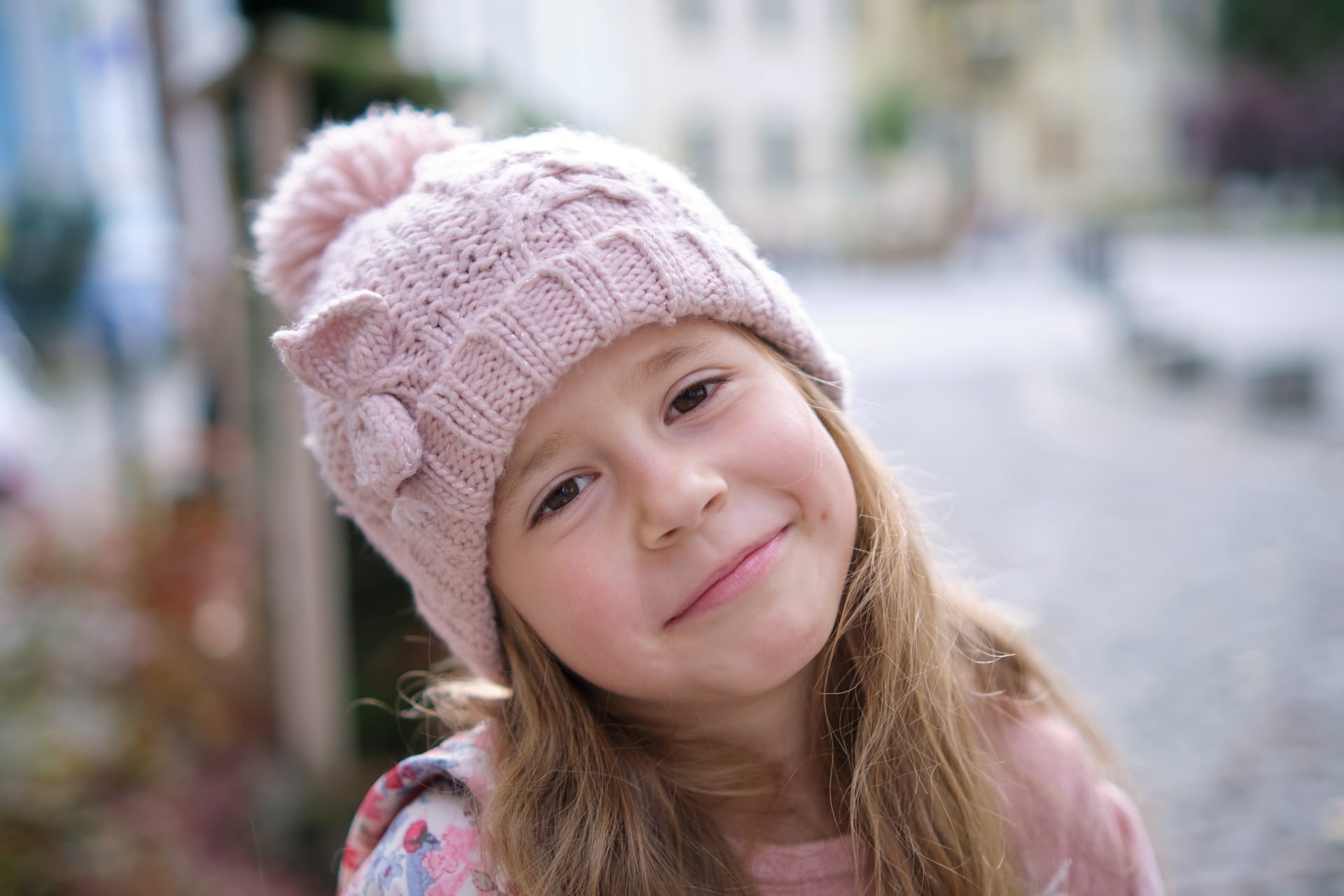 Portrait cute little child girl pink hat
