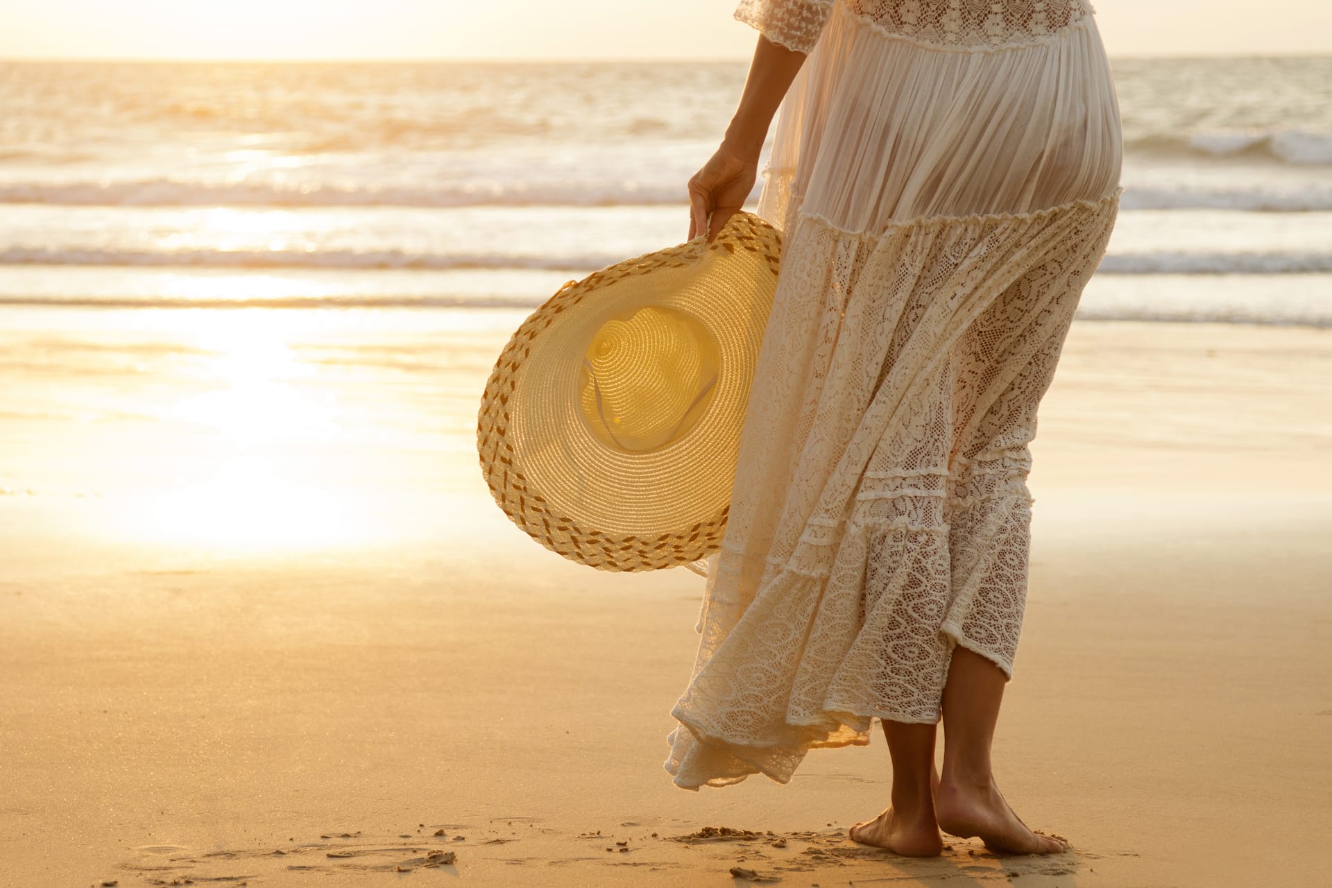 Woman wearing beautiful white dress beach