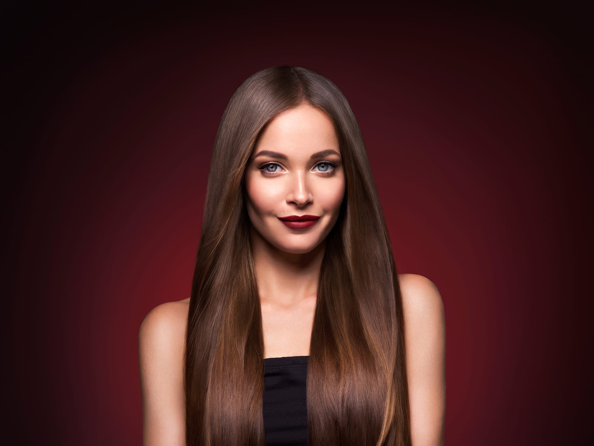 Long smooth brunette hairstyle beauty healthy hair female model portrait studio shot