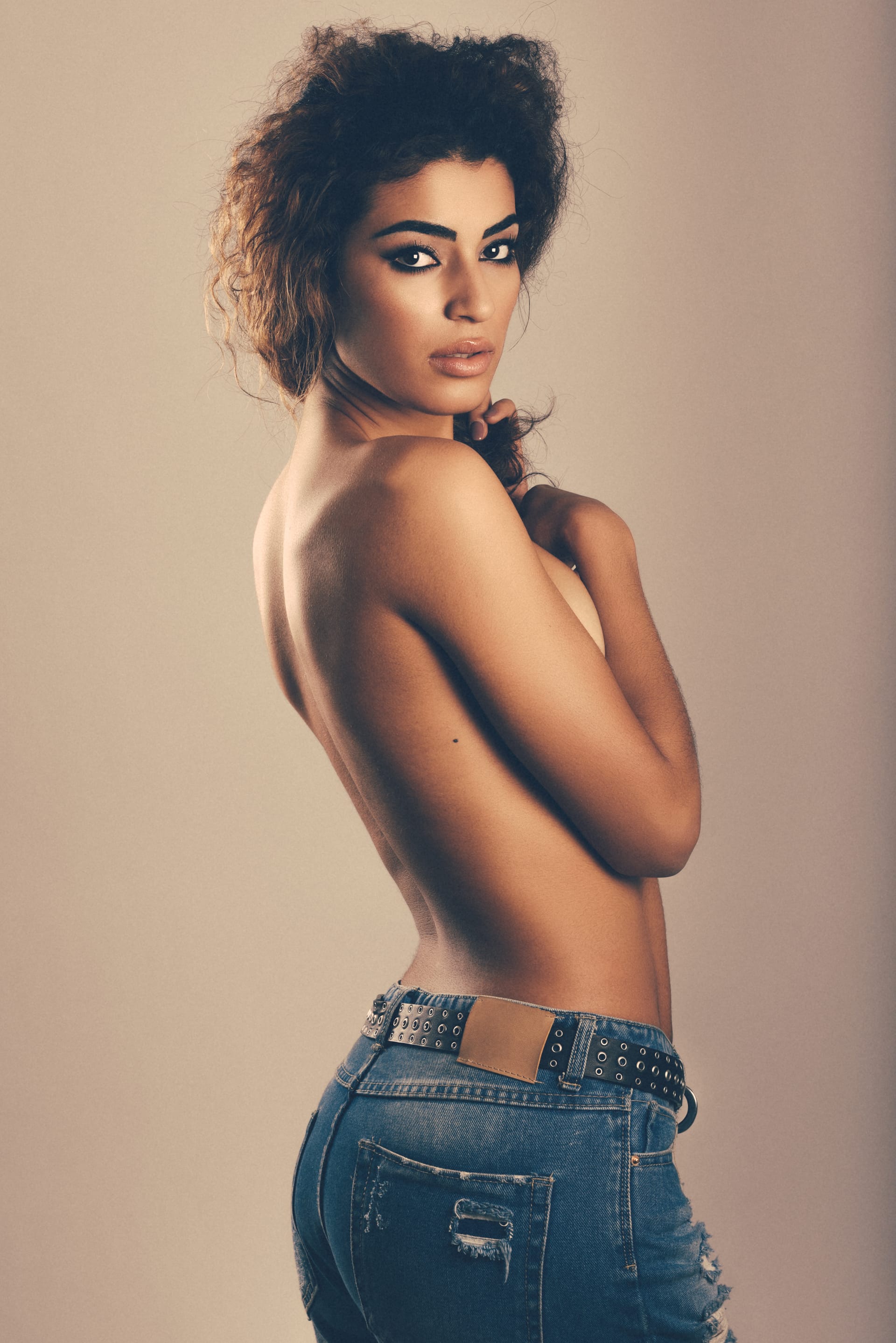 Young woman with beautiful back wearing blue jeans beautiful female models photos
