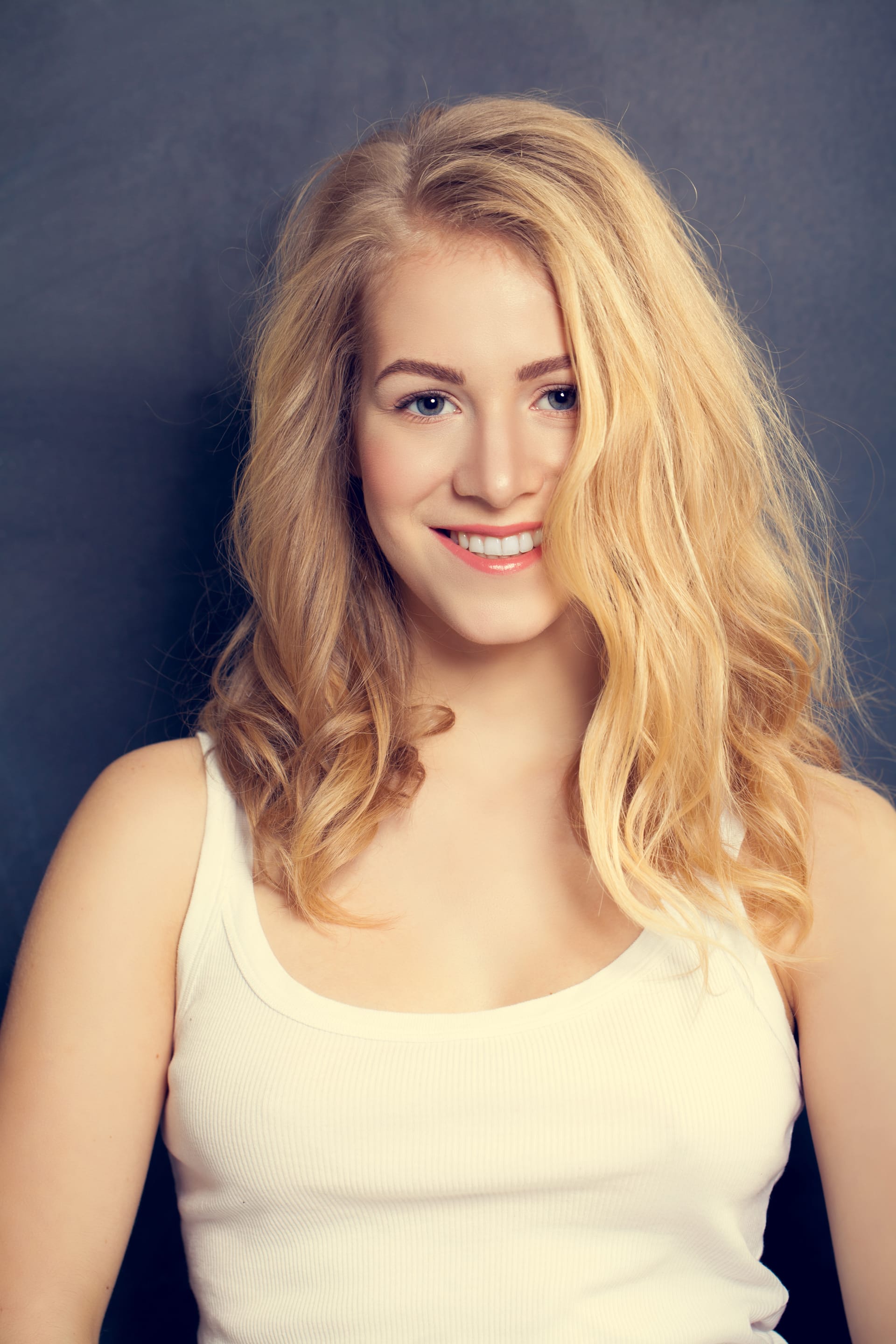 Smiling blonde woman dark background makeup curly hairs beautiful ladies photos