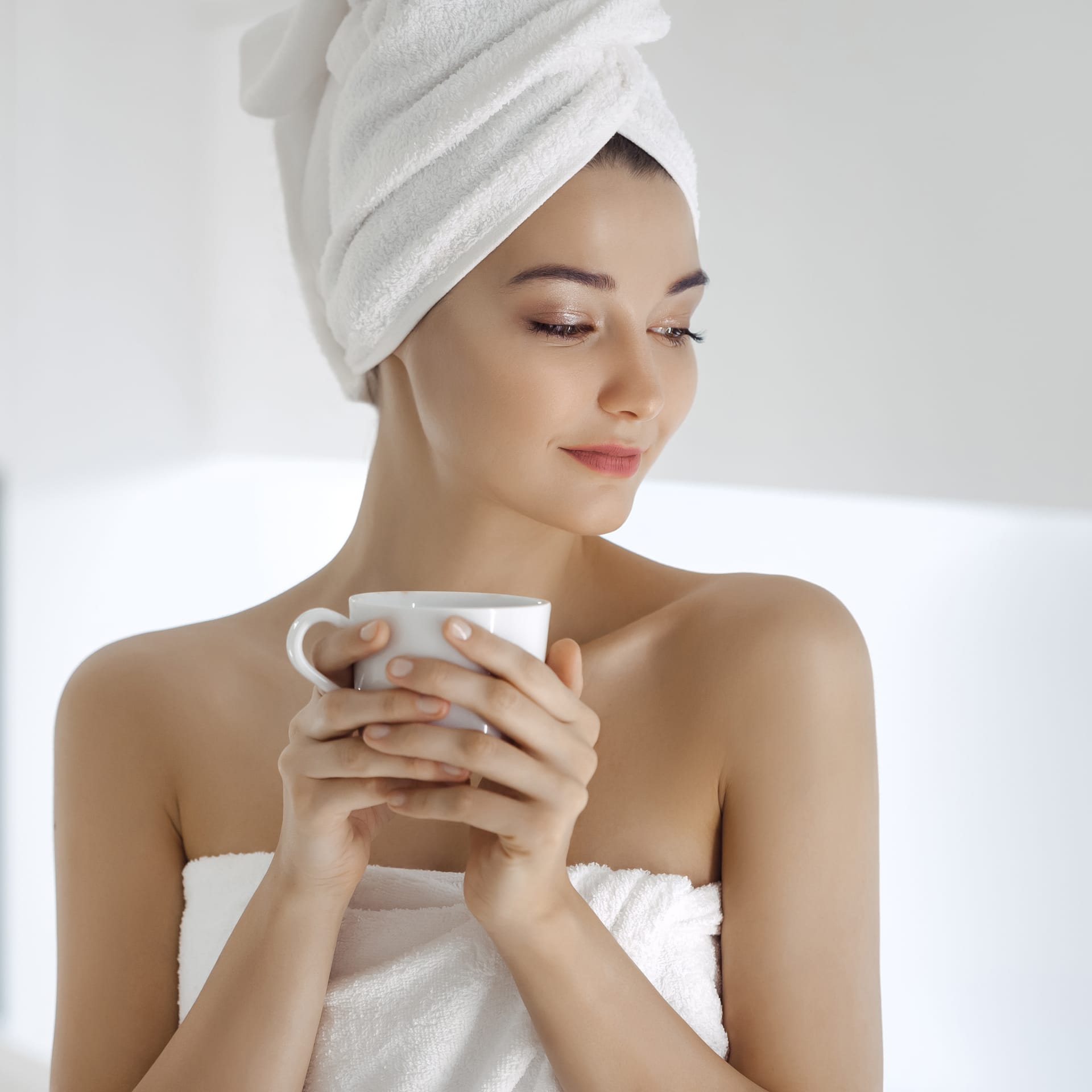 Young woman towel enjoying coffee home
