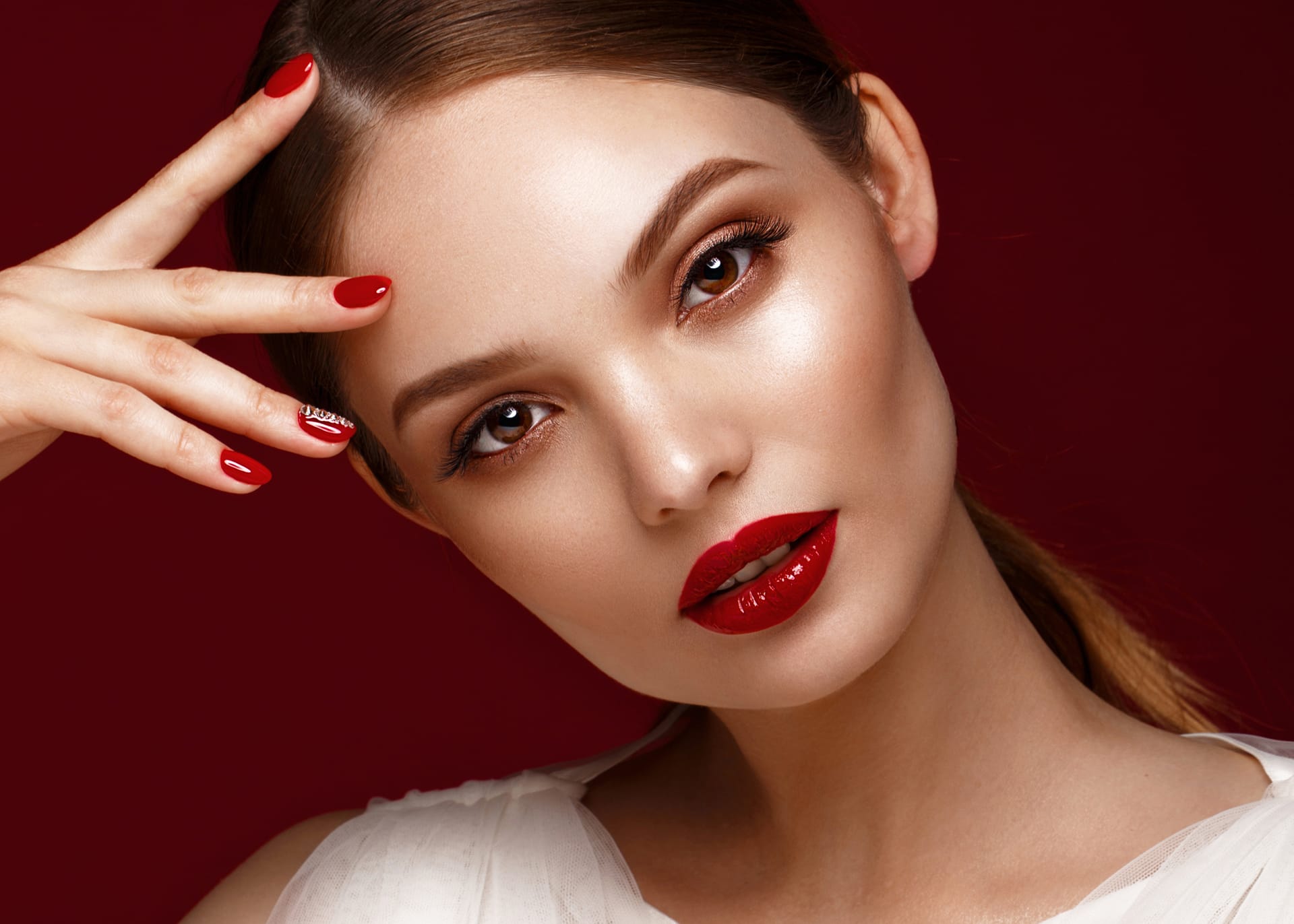 With classic makeup red manicure beauty face photo taken studio