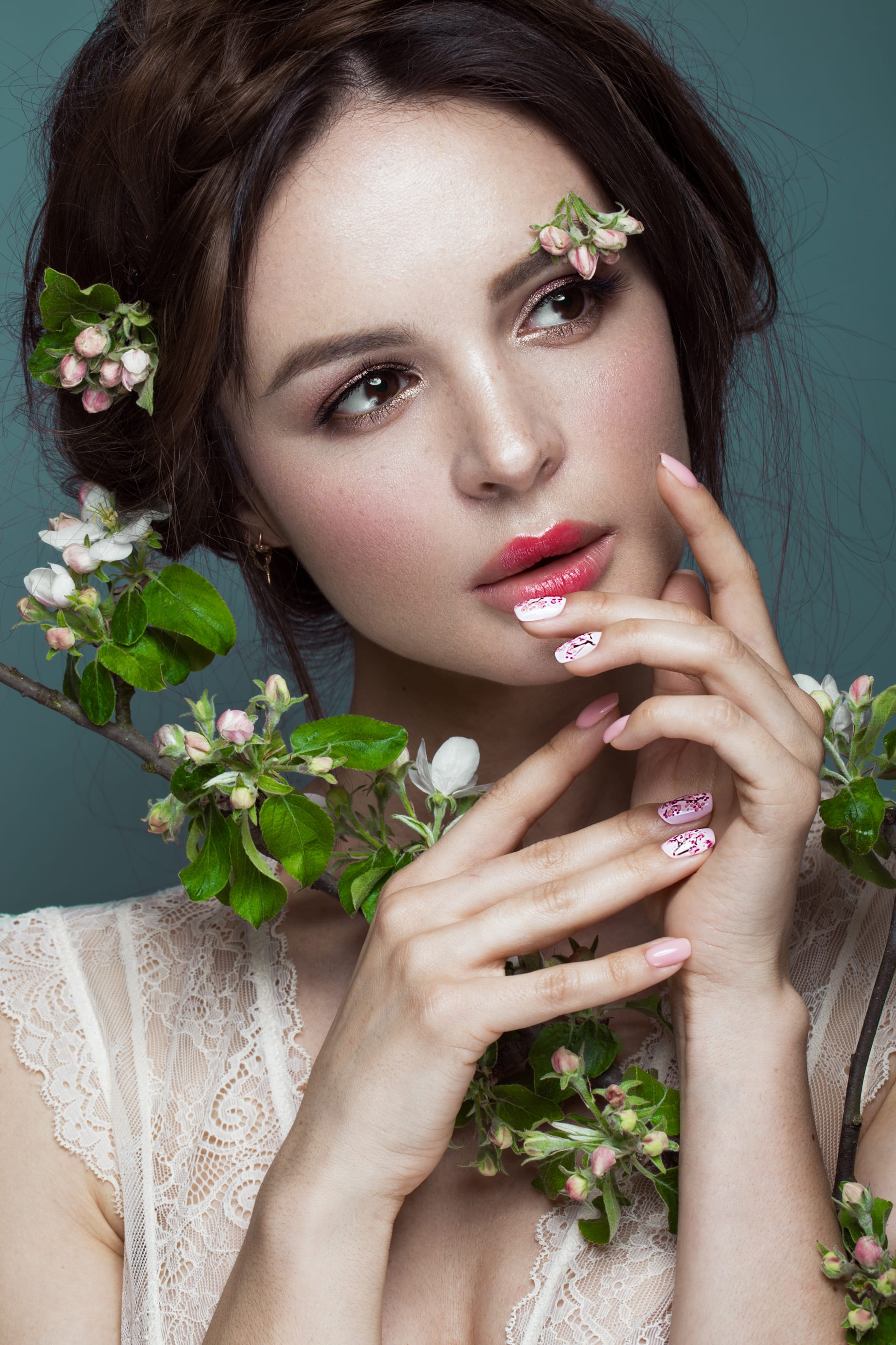 With gentle romantic makeup pink lips holding flowers beauty face