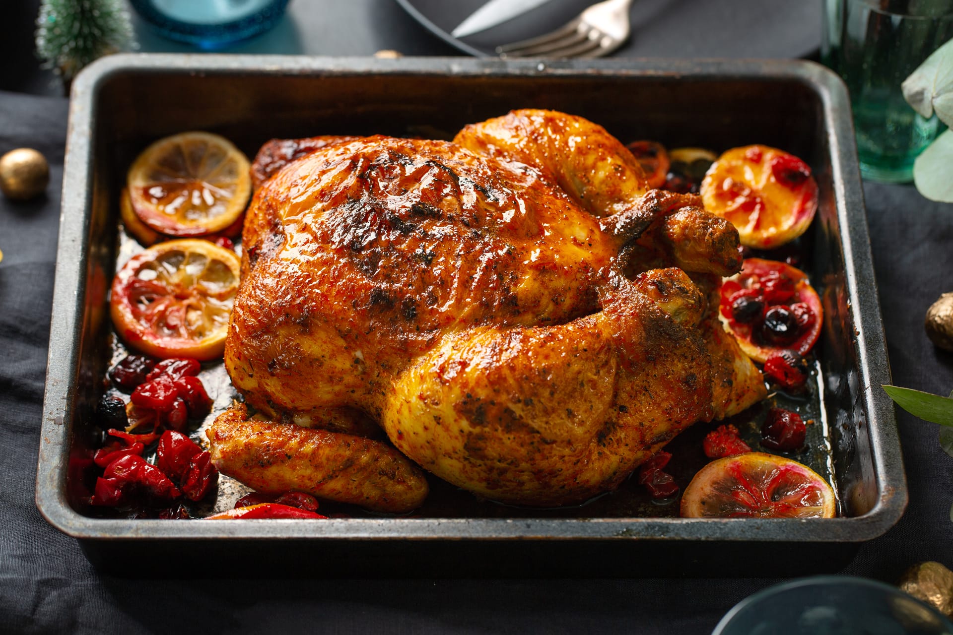 Whole chicken with oranges cranberries oven form closeup nice image