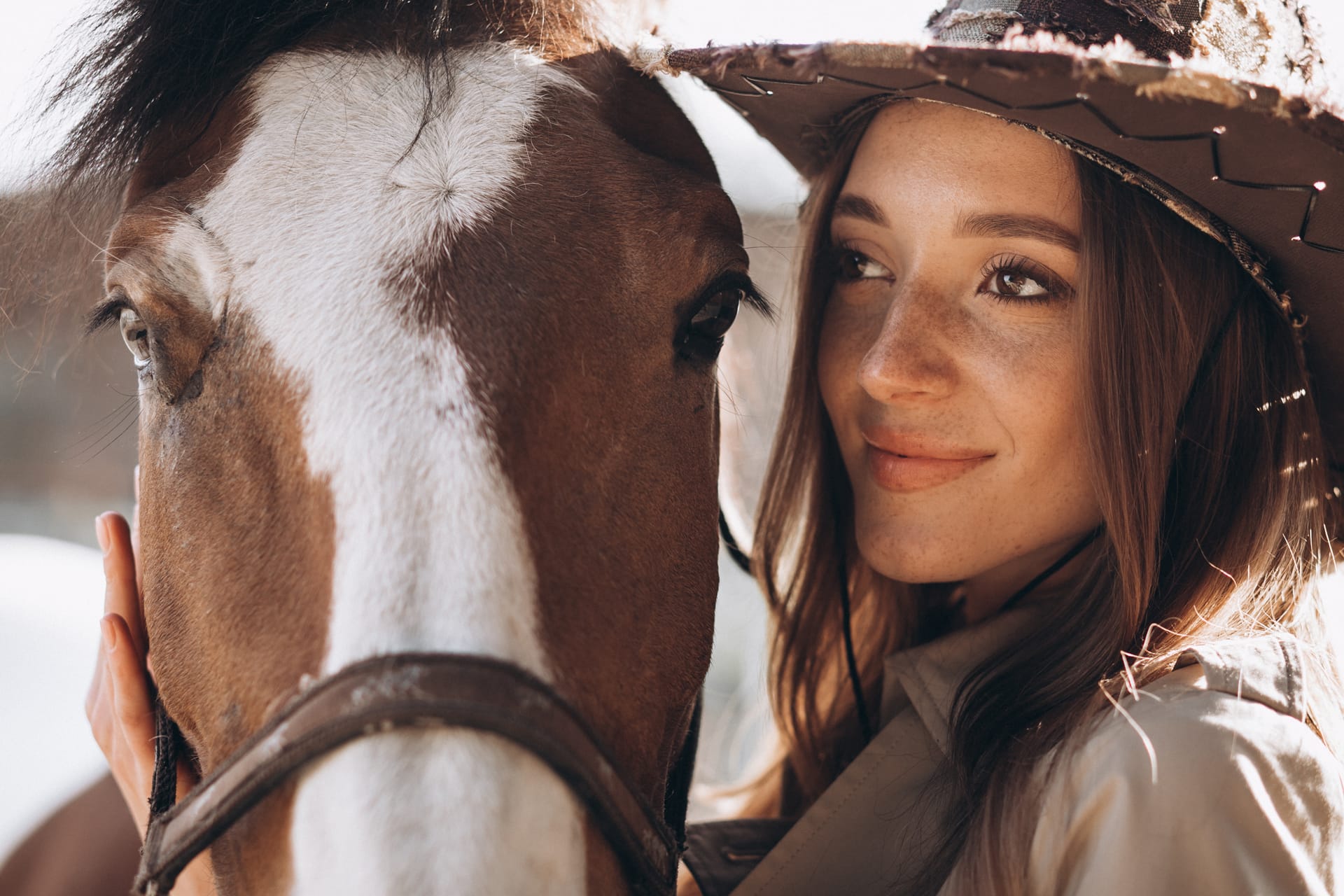 Young happy woman with horse ranch
