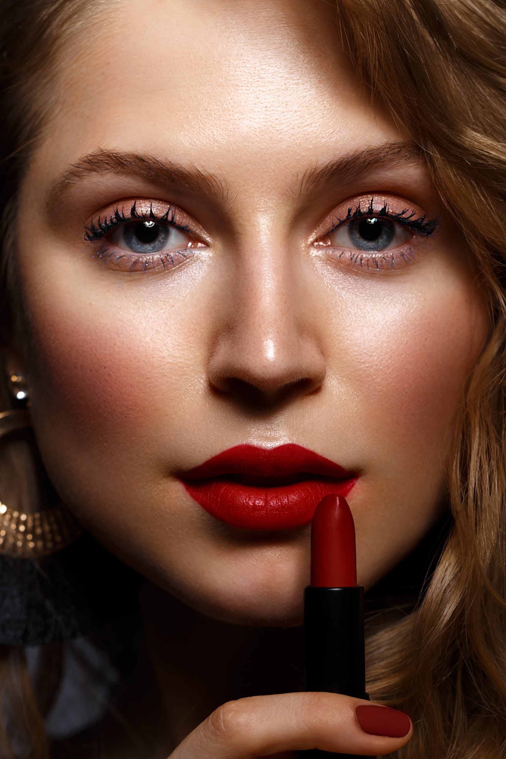 Red lips classic makeup curls with lipstick hand beauty face