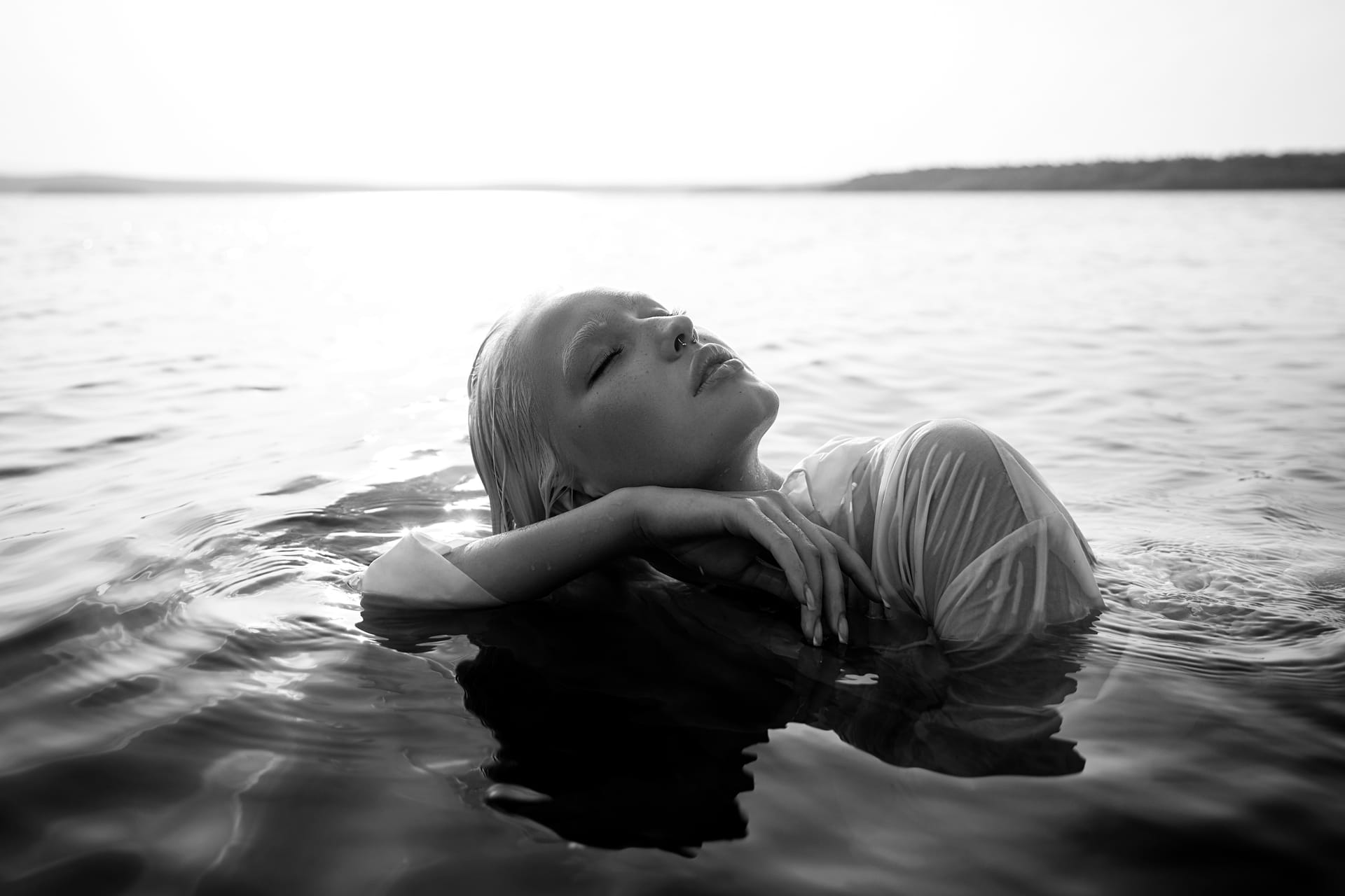 Short hair lies water sea shore pond art portrait relaxing woman water shore