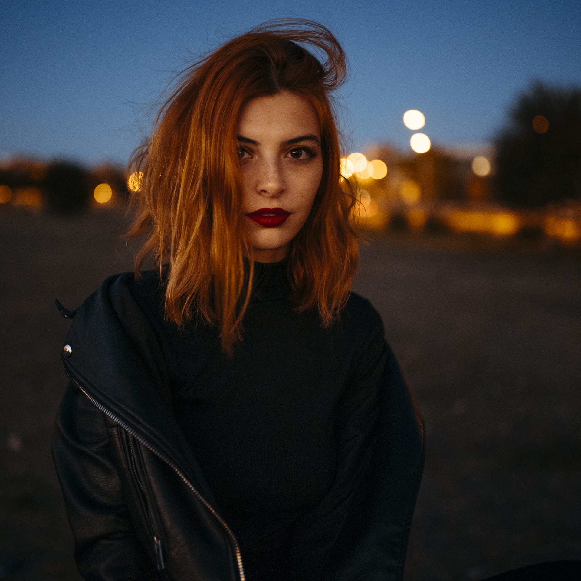 Portrait beautiful young woman with redr sunset high quality photo