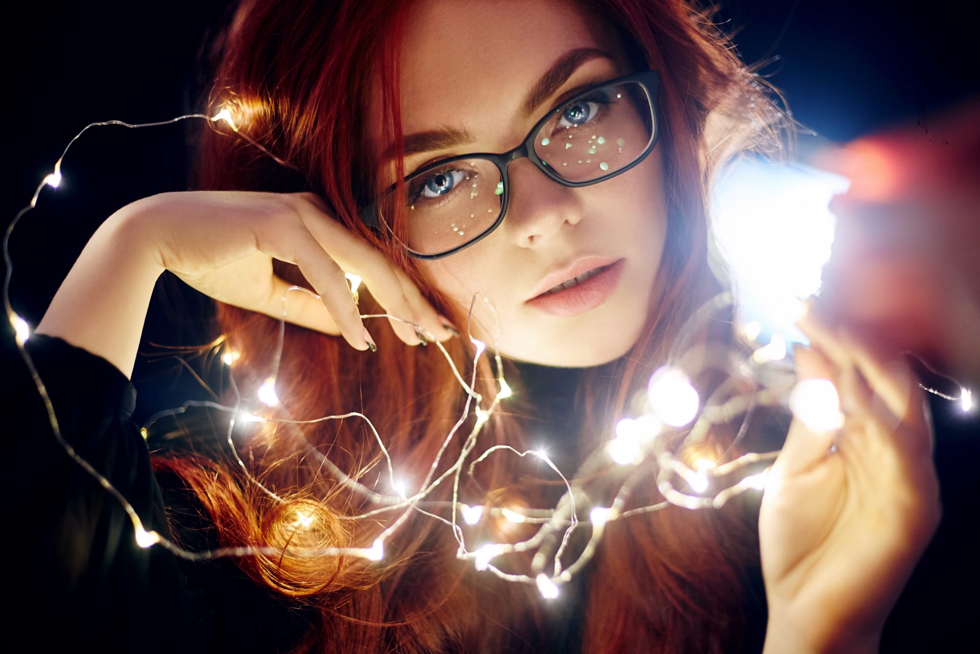 Portrait woman with red hair christmas lights pretty woman photos