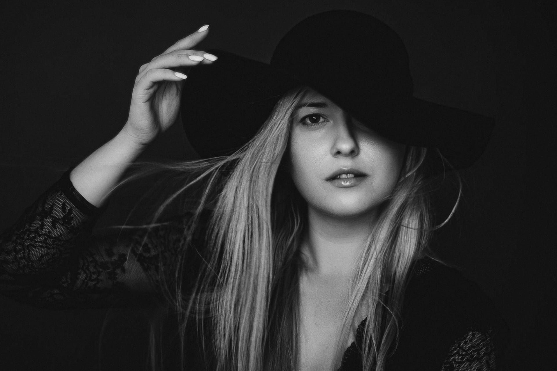 Woman wearing hat artistic film portrait black white fashion campaign beauty brand
