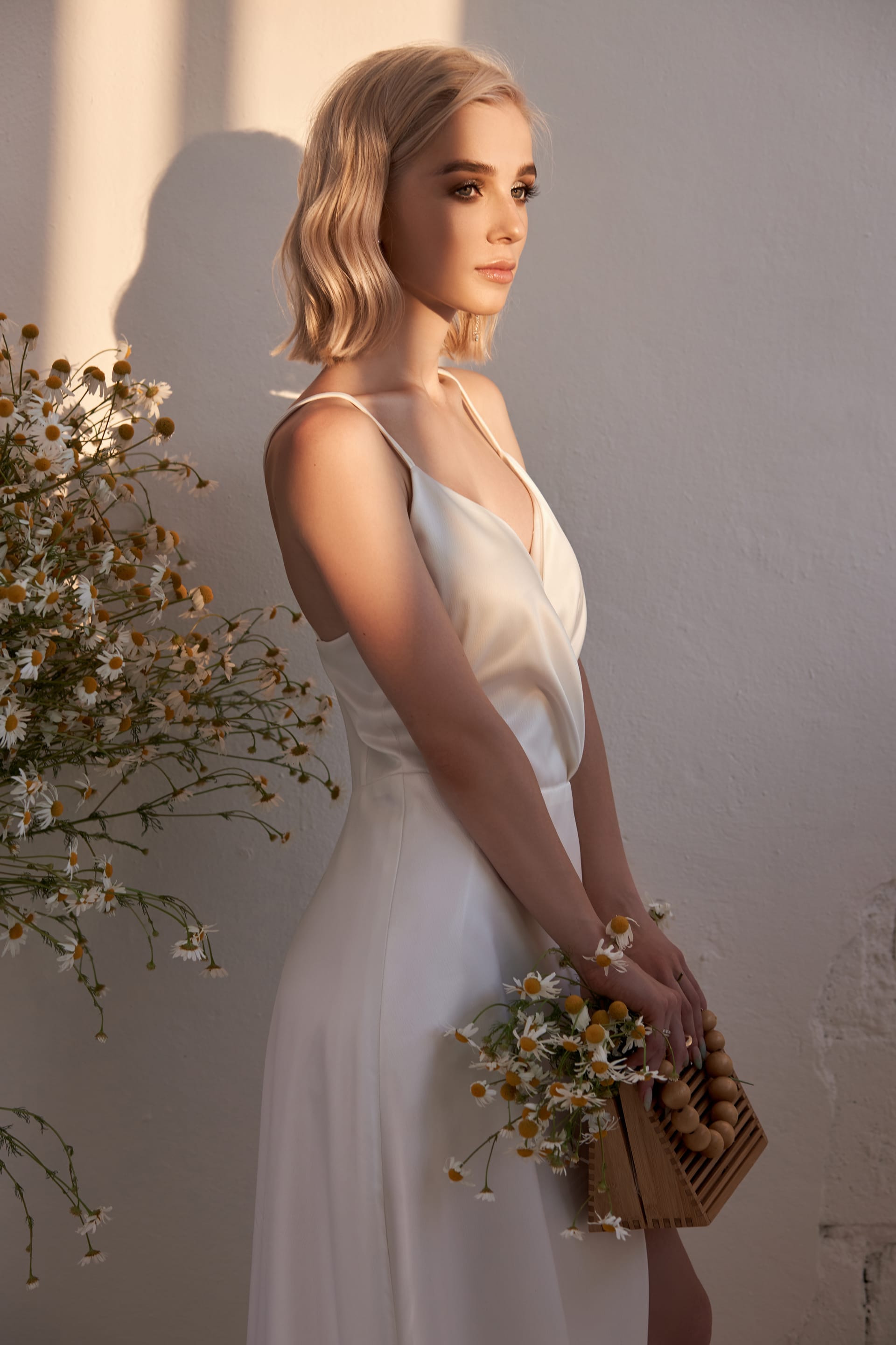 Blonde woman white wedding dress evening sun image