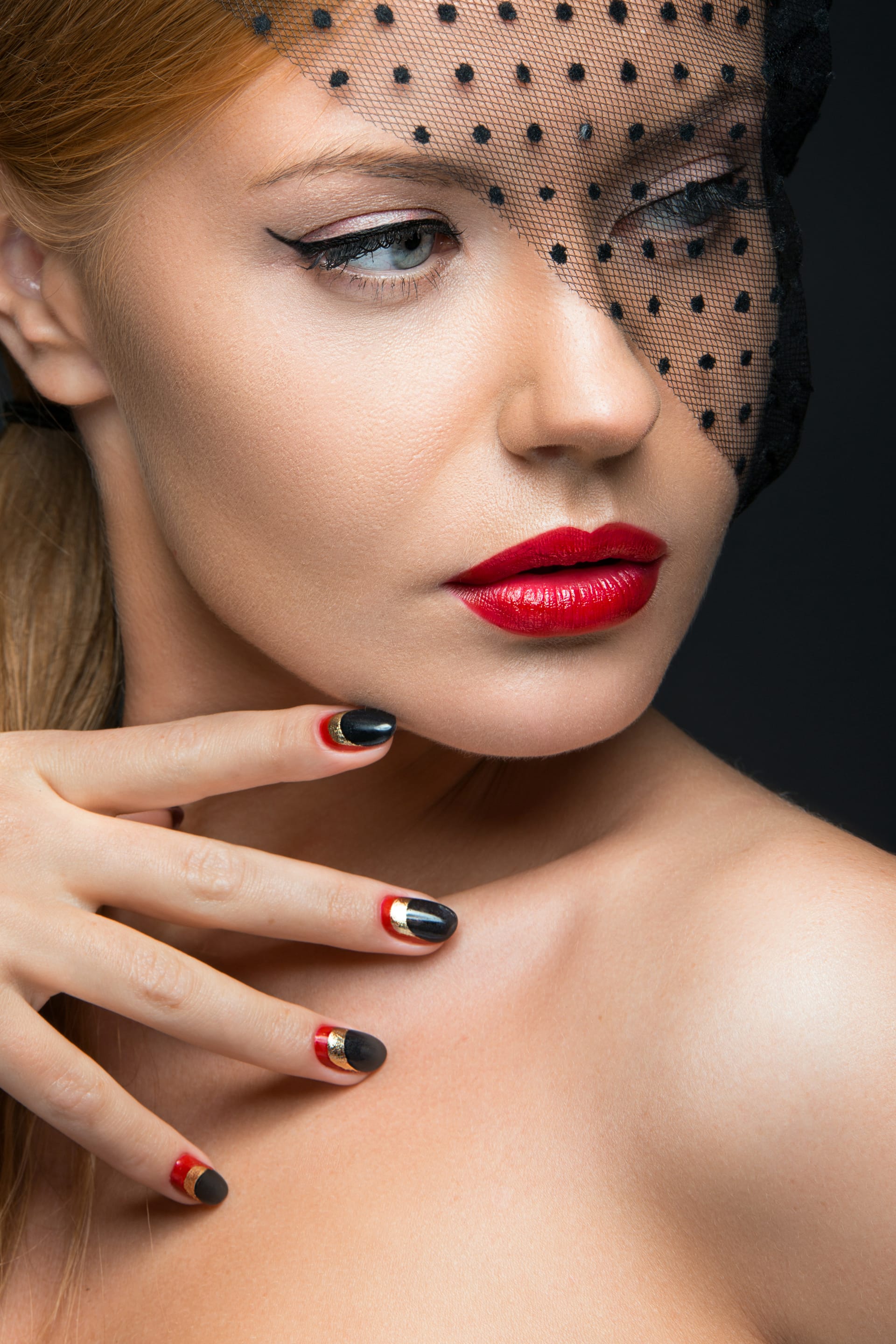 Girl with veil evening makeup black red nails