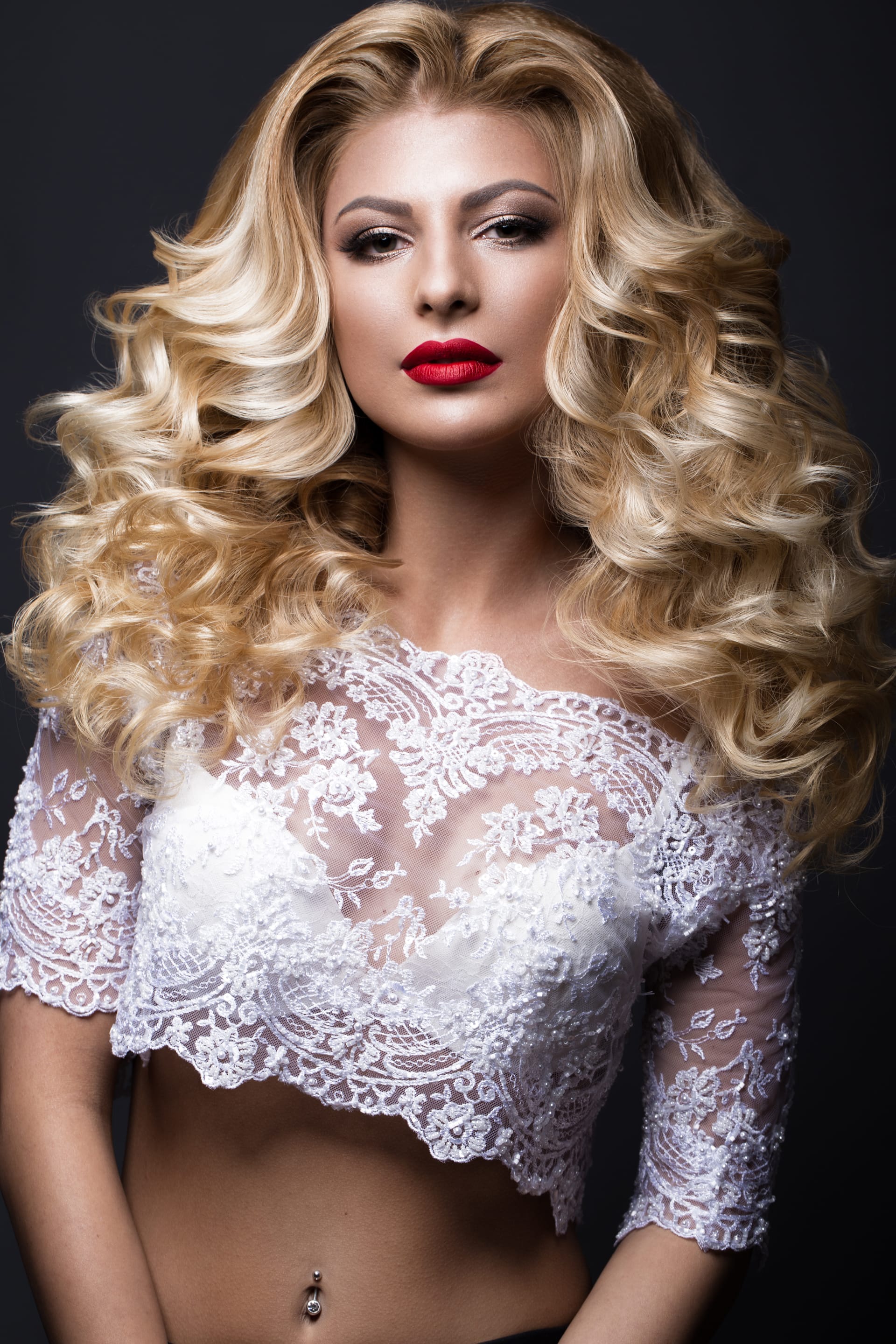 Wedding image woman with curls red lips beauty face