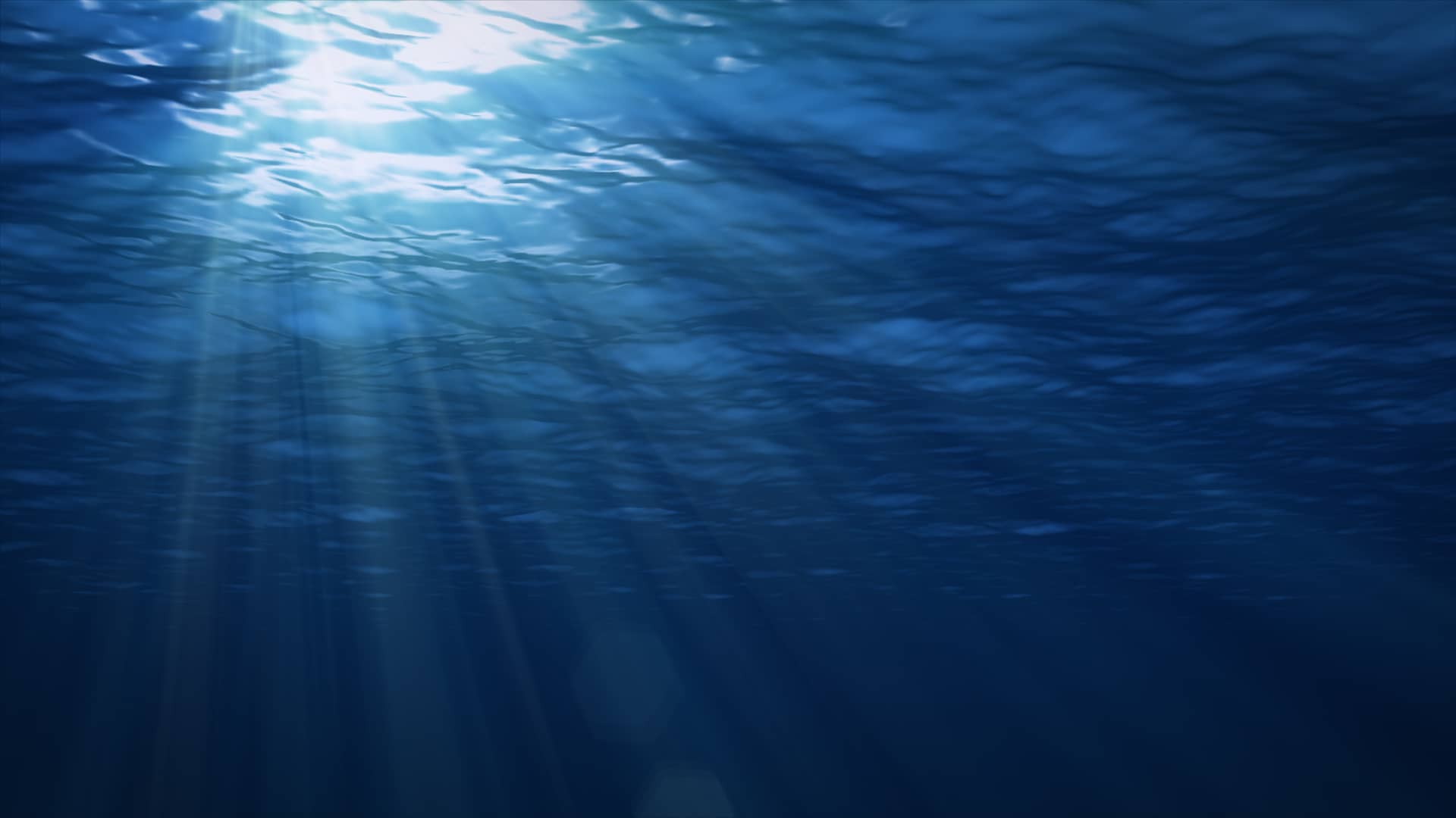 Sun make their way depths through surface water underwater background