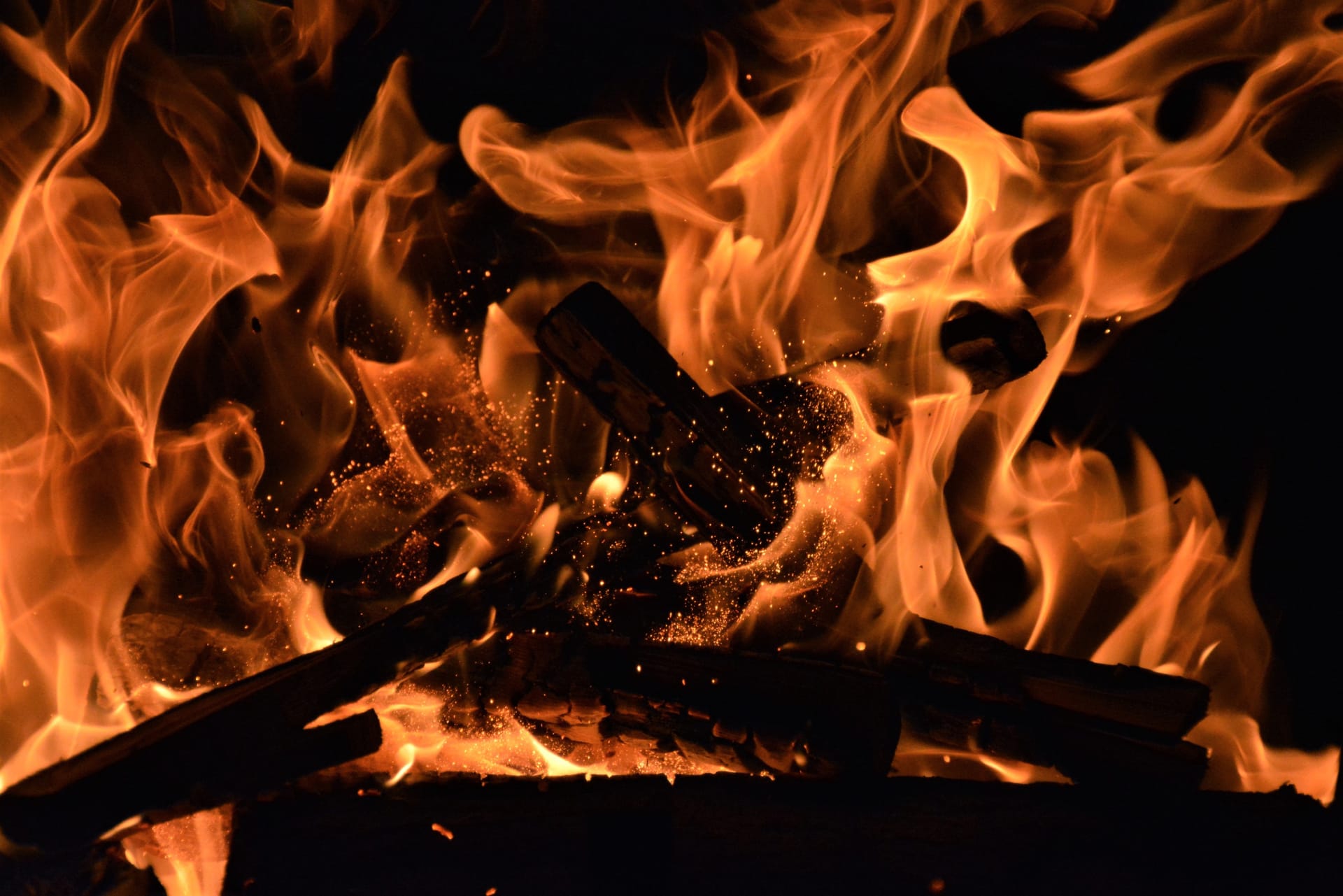 A pile of burning wood flames