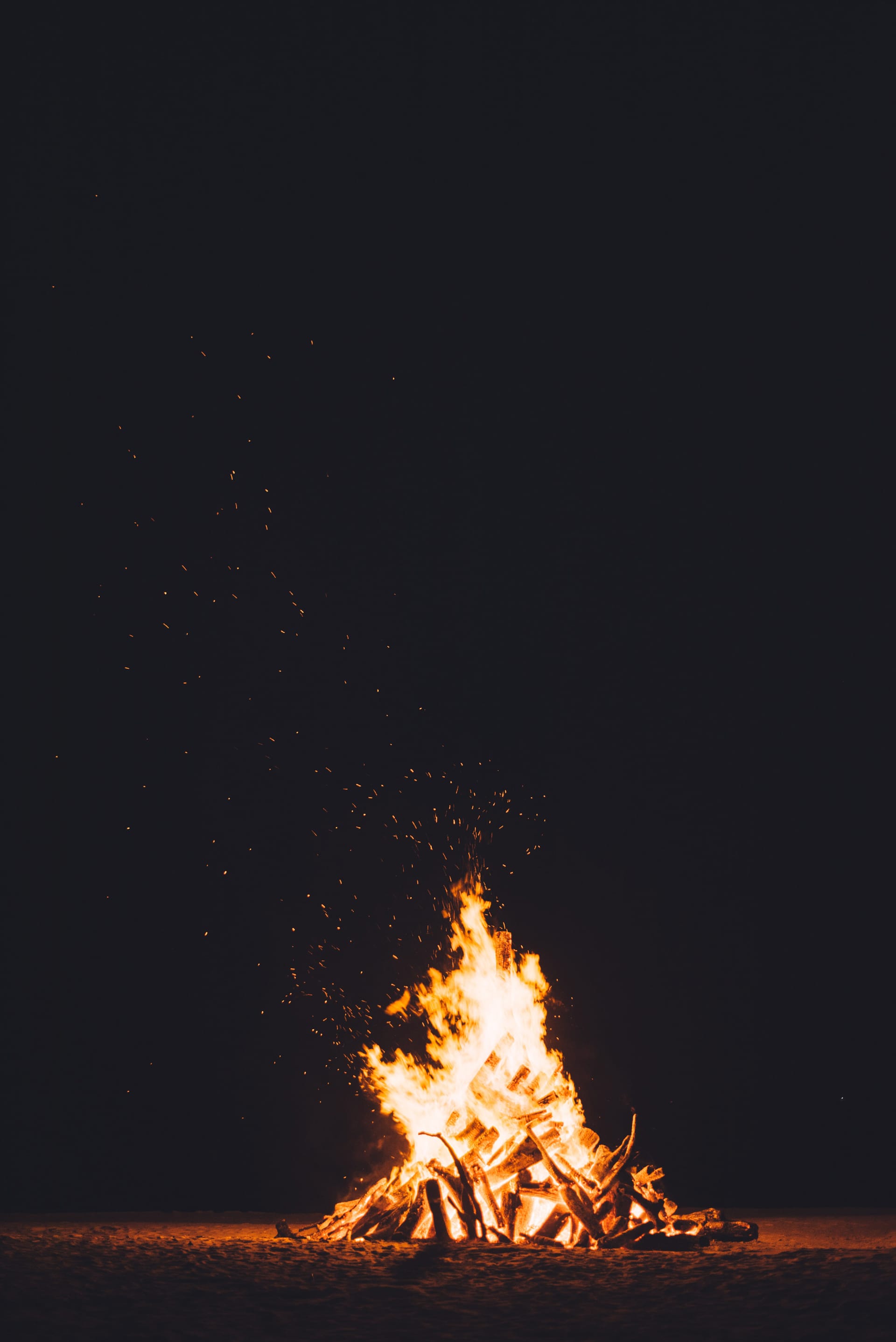 A pile of flames in the darkness background