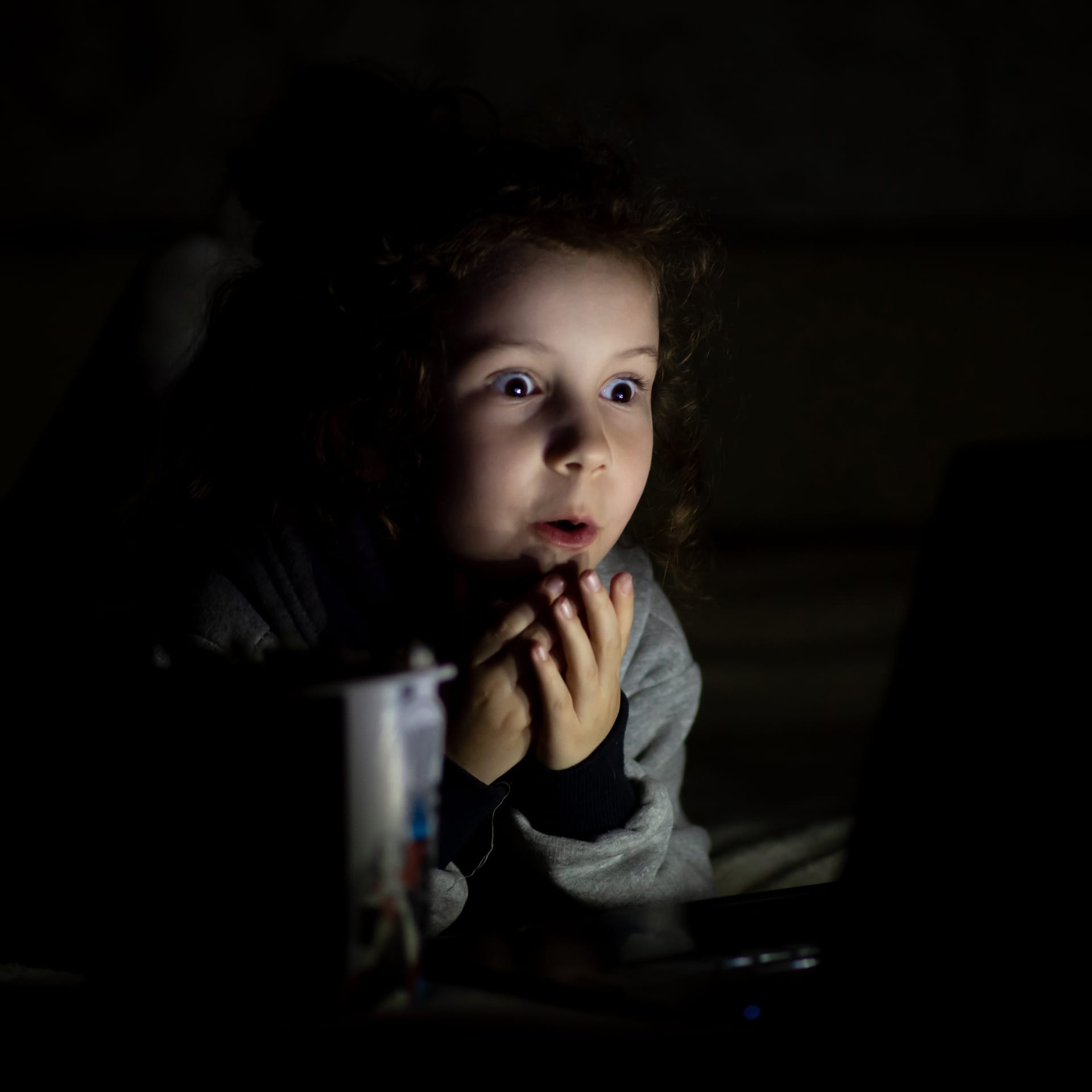 Girl watches cartoons dark she s home childhood leisure