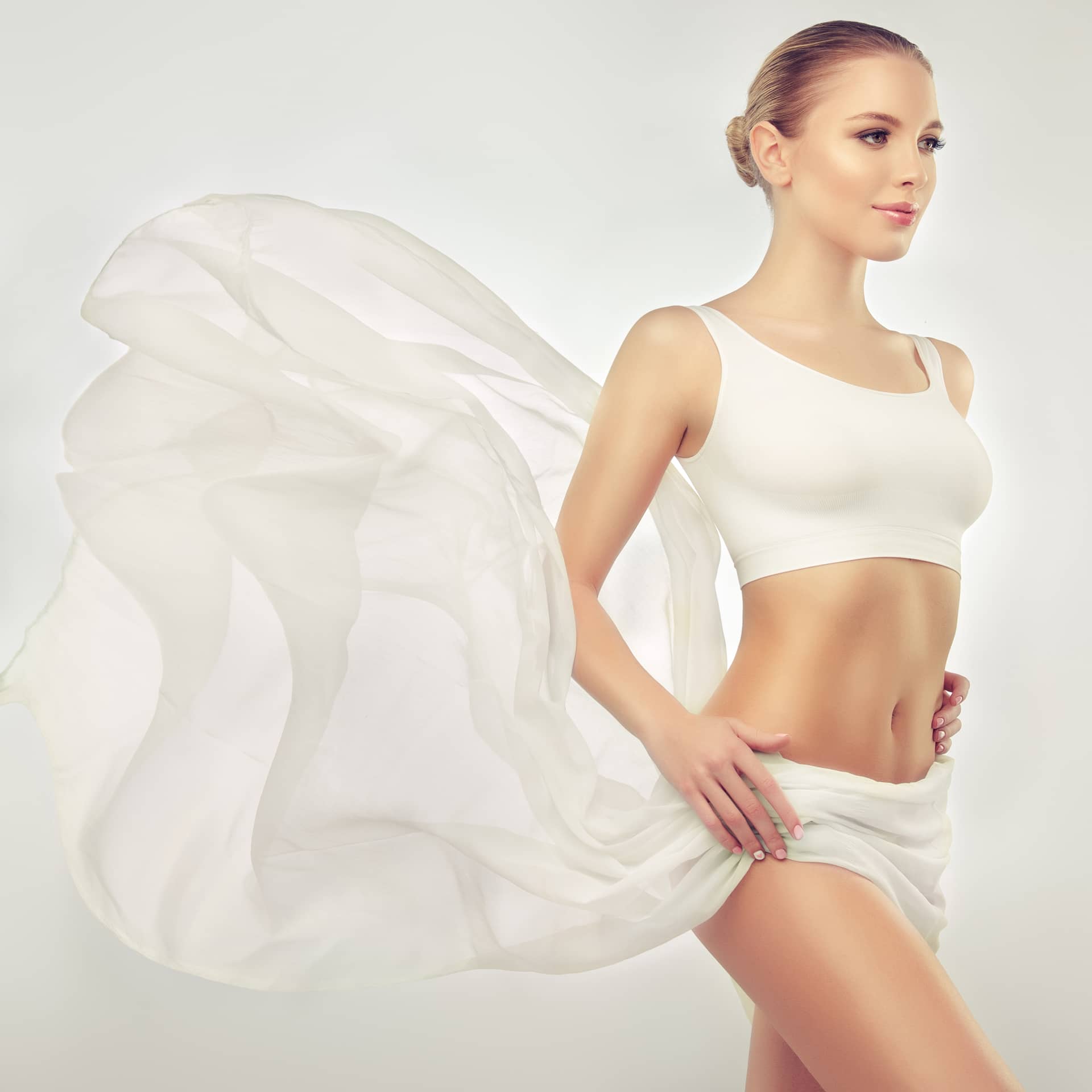 With graceful slim body dressed white sport underwear slender female