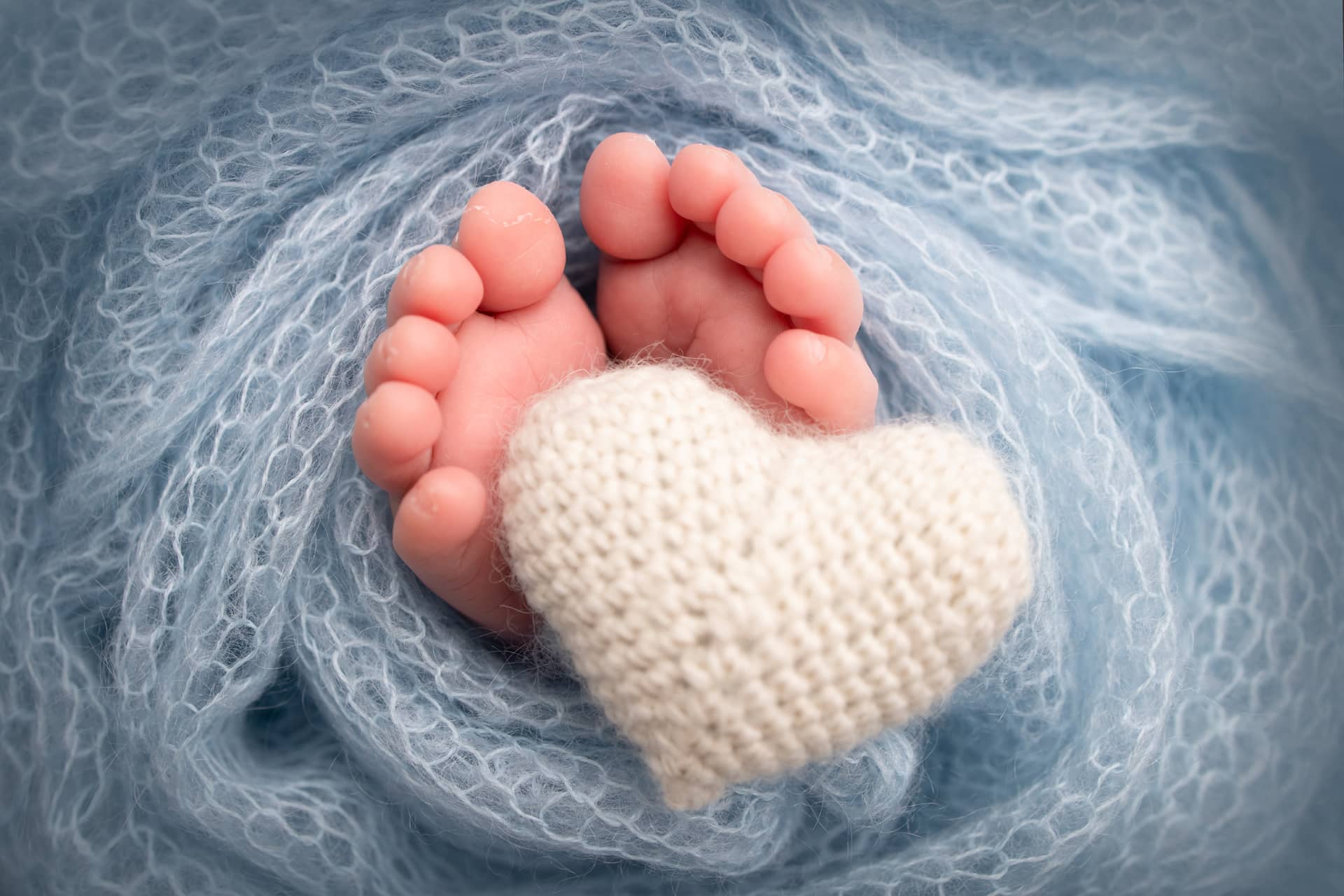 Feet newborn knitted white heart legs baby macro photography image