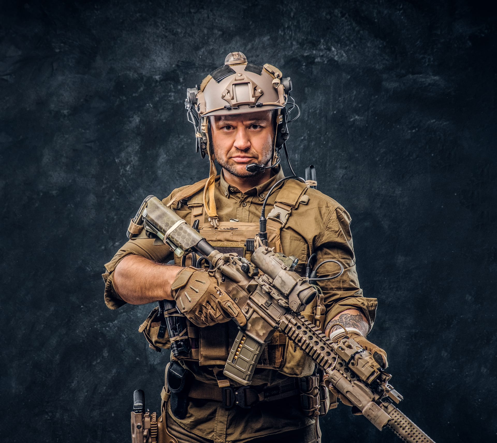 Soldier camouflage uniform posing with assault rifle