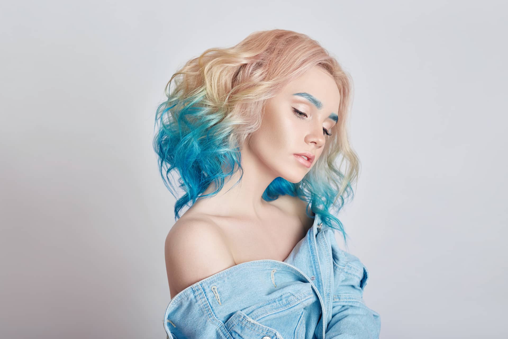 Portrait woman with bright colored flying hair profile photo