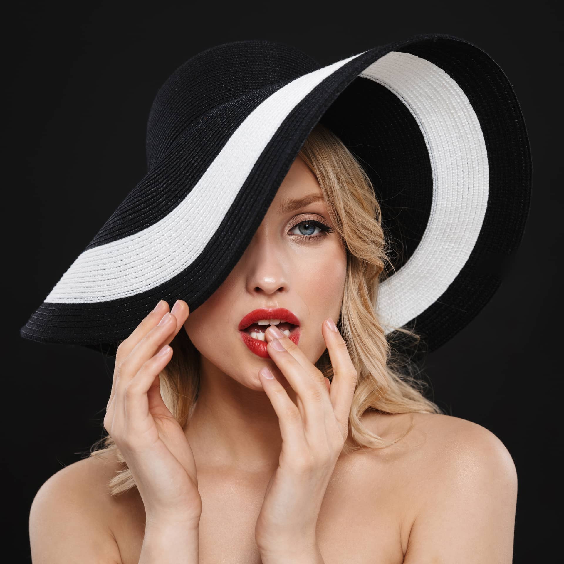 Profile photo with bright makeup red lips posing isolated wearing hat picture