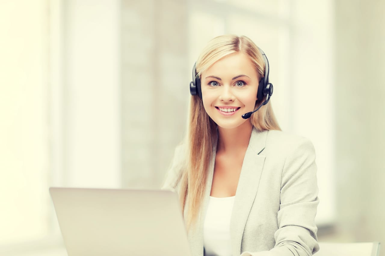 Related image smiling female helpline operator with headphones laptop