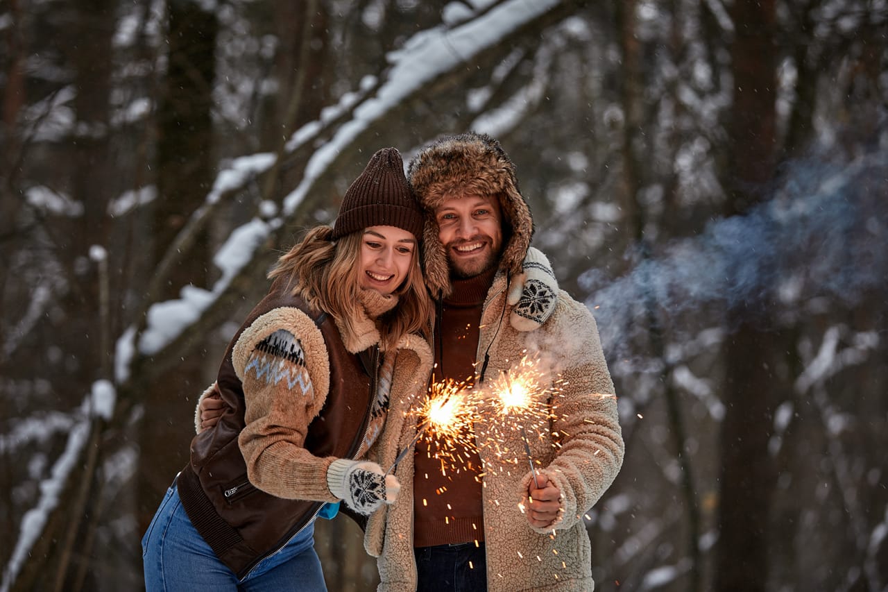 Related image couple love story snow forest kissing holding sparklers couple winter nature couple celebrating valentines day