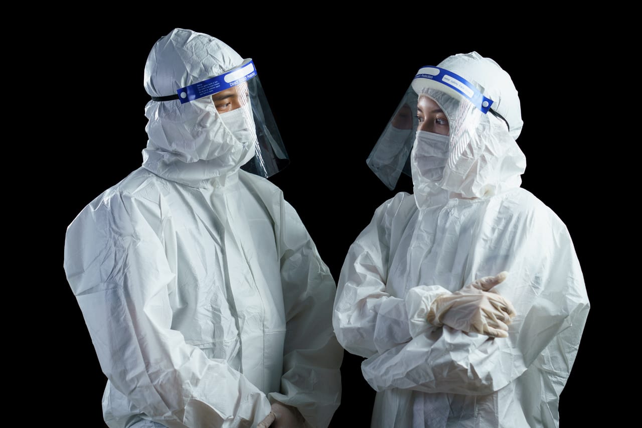Related image doctor wearing ppe face shield looking corona covid 19 virus laboratory report