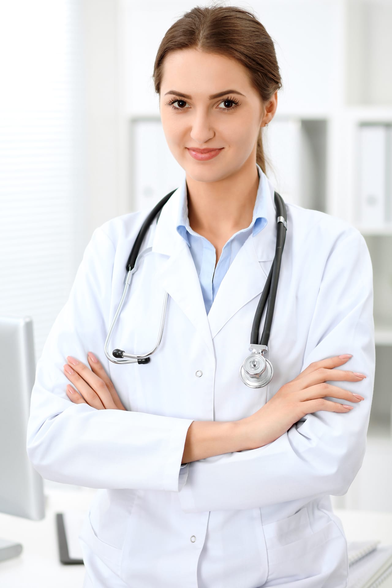 Related image doctor woman standing with arms crossed smiling hospital physician ready examine patient