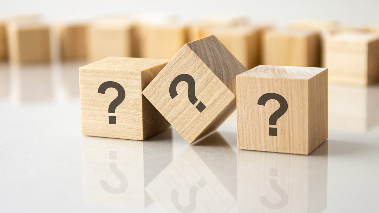 Related image three question marks written wooden cubes lying gray table business education concept