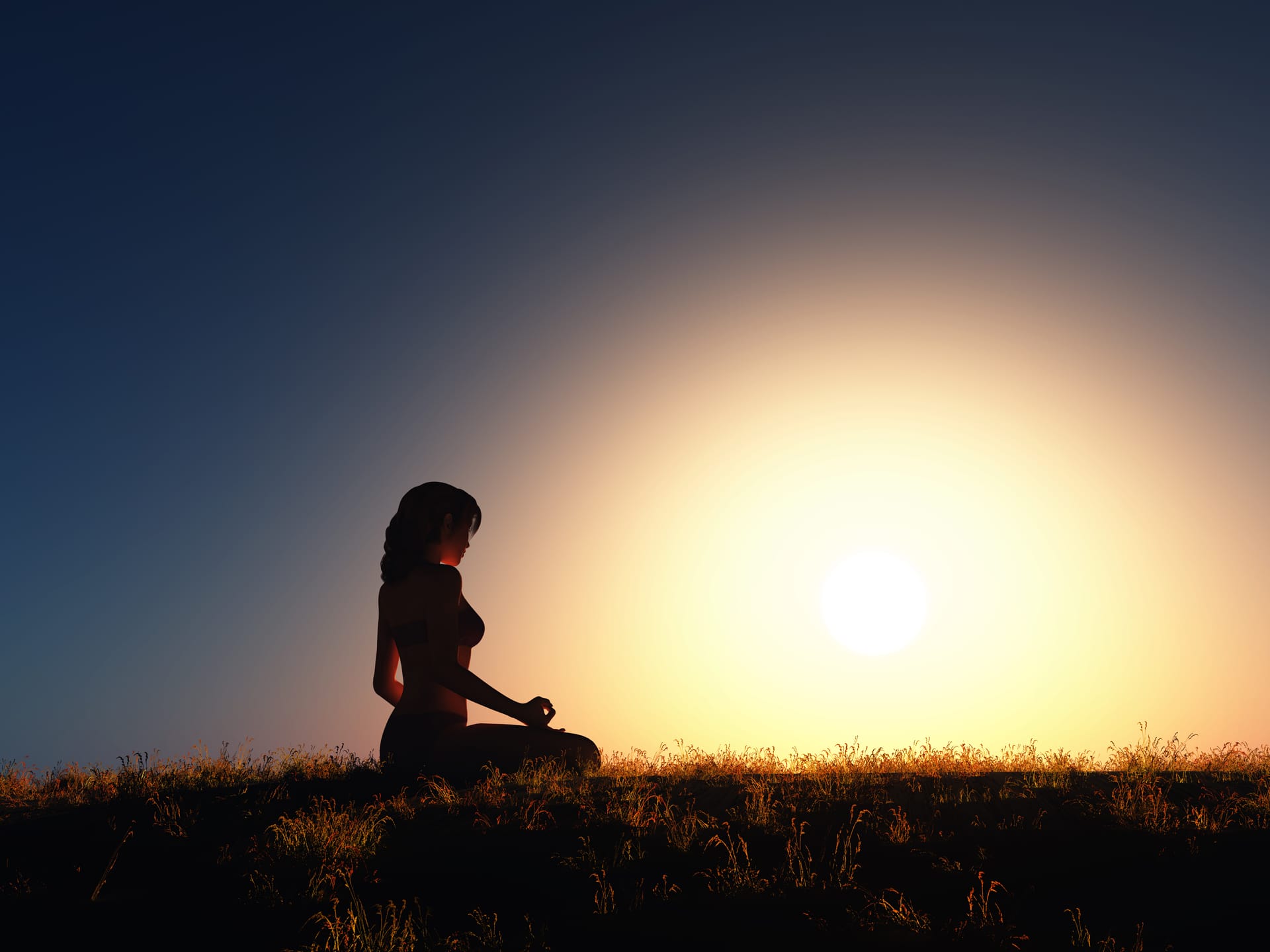 Female yoga position against sunset sky